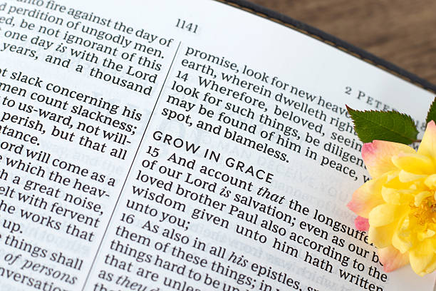 istock Grow in grace text in open holy bible book 2217515263