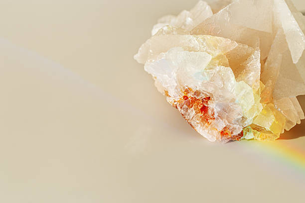 istock Luminous Quartz with Rainbow Flares. Sun's rays interact with quartz stone, iridescent rainbow glares, background with shining crystal at sunlight, aesthetic view with natural light effect 2217517829