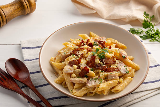 istock Creamy Penne Pasta Carbonara sauce bacon 2217519214