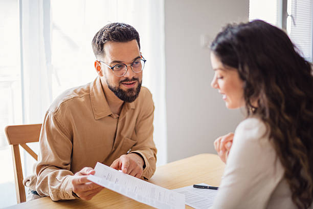istock Financial advisor showing contract to client during a meeting 2217524039