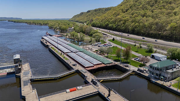 Located along the Mississippi River between Minnesota and Wisconsin's Driftless area, the Thomas Erickson Towboat and barges enter the US Lock & Dam #5.