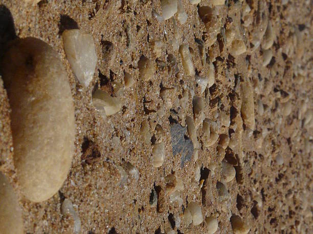 istock Natural Pebbles and Sand Composition on a Beach 2217526671