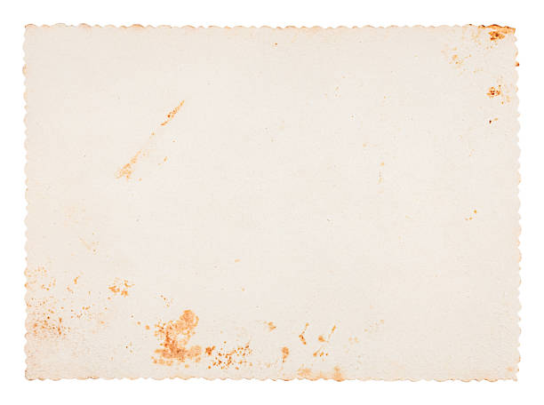 istock Vintage stained blank paper texture with scalloped edges isolated on white background 2217526811