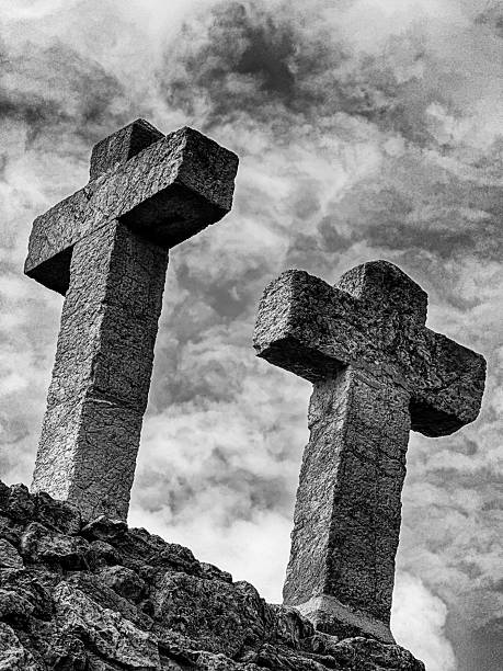 istock Two Crosses Against The Sky In Black And White 2217527347