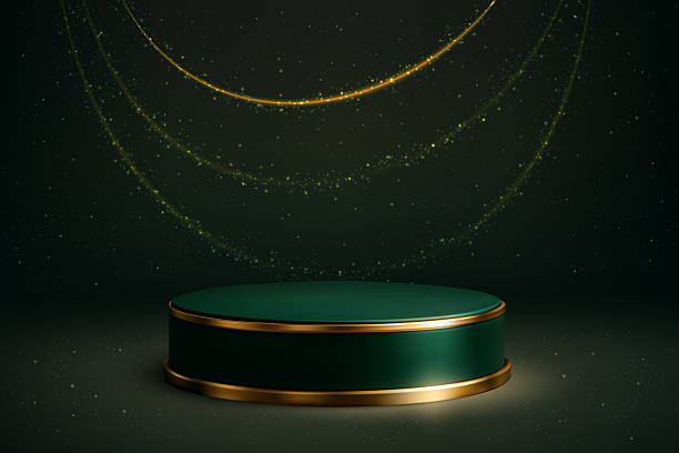 istock Green podium with golden edge on sparkling dark background 2217527977