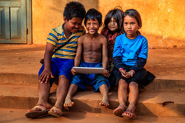istock Happy Cambodian children using tablet on a schoolyard, Cambodia 2217528190