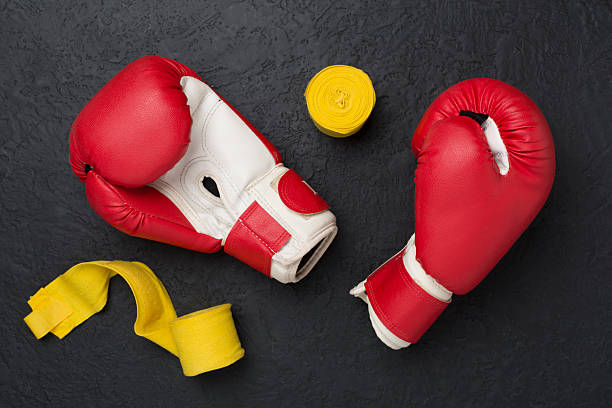 istock Red boxing gloves on concrete background, top view. 2217529396