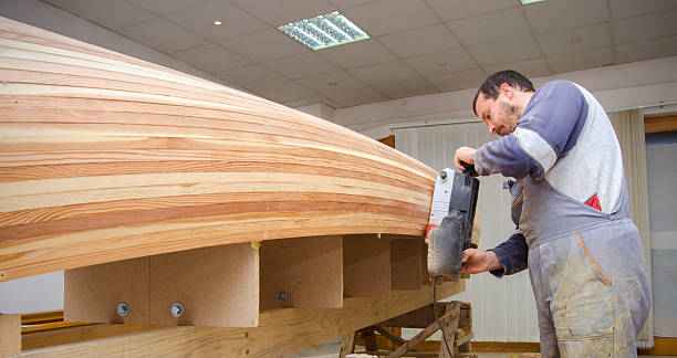 istock Carpenters making canoe in their woodshop 2217529669