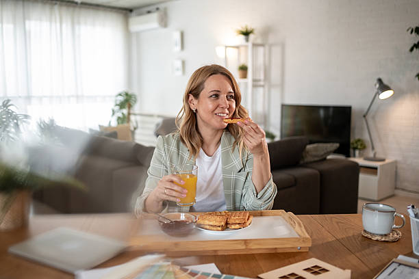 istock Architect enjoying breakfast and planning new project at home 2217530124