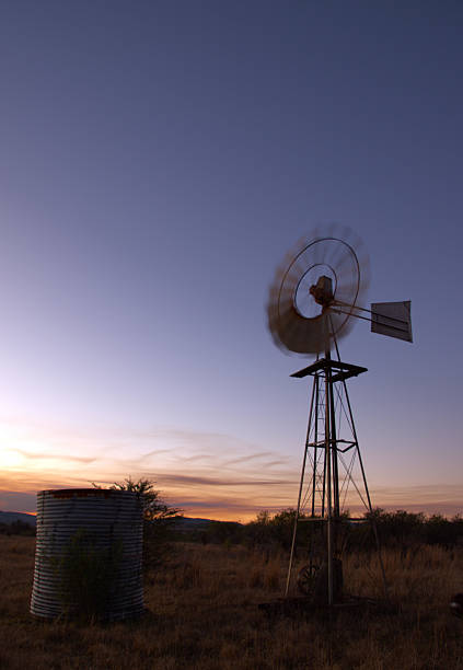 istock Rustic Windmill at Sunset Amid a south african Countryside Landscape 2217531031