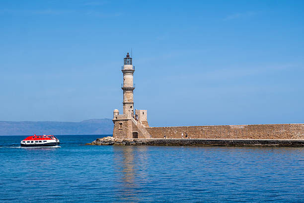 istock Chania Crete. Lighthouse at old venetian harbor, blue sky 2217532200
