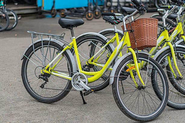 istock Modern colored bicycles neatly lined up against a wall in an indoor space with light flooring and visible ceiling structures No people or texts are present Even artificial lighting 2217532486