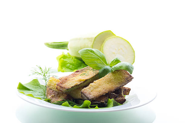 Zucchini with a crispy crust and fresh salad.