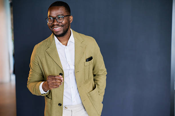 istock Young black businessman smiling and looking away 2217544565