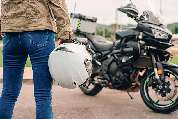 istock Biker helmet and motorcycle in blur background 2217548474