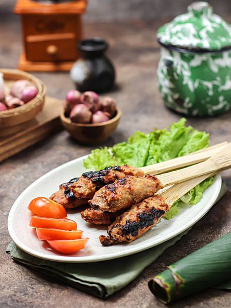 istock Sate lilit or sate pusut, satay made from of mashed chicken or beef, mixed with grated coconut and spices 2217549095