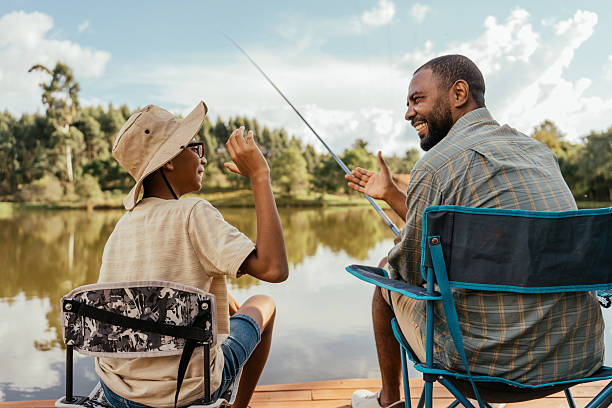 istock Happy father and son fishing 2217550280