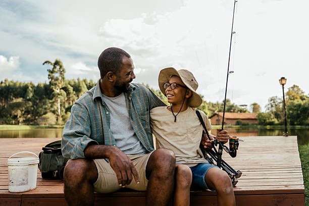 istock Father and son talking after fishing 2217550364