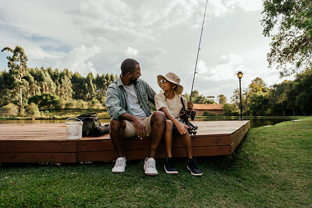 istock Father and son talking after fishing 2217550367