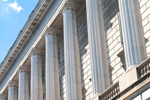 istock Symmetrical white monumental columns on the facade of the building. 2217552509
