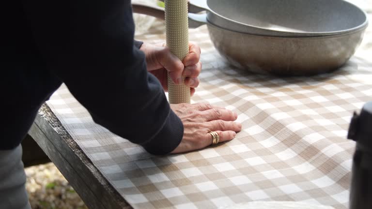 A woman making gohei mochi