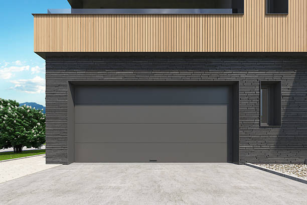 istock Modern Double Garage Entrance with Dark Sectional Roll-Up Doors 2217568273