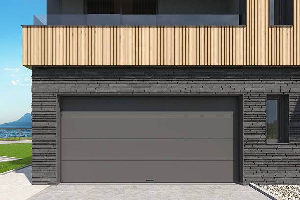 istock Modern Double Garage Entrance with Dark Sectional Roll-Up Doors 2217568299