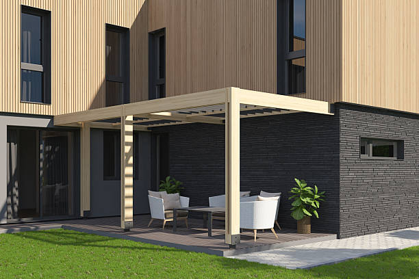 istock Modern Backyard Terrace with Canopy, Wood Decking, and Scandinavian Facade 2217568440