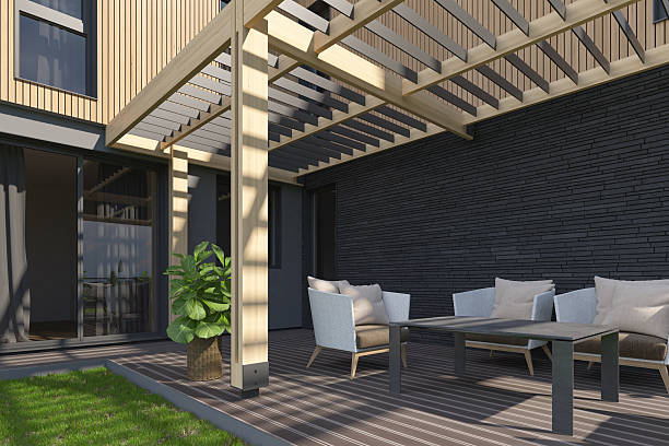 istock Modern Backyard Terrace with Canopy, Wood Decking, and Scandinavian Facade 2217568466