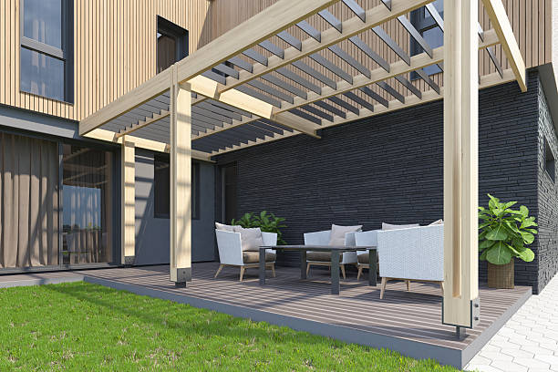 istock Modern Backyard Terrace with Canopy, Wood Decking, and Scandinavian Facade 2217568501