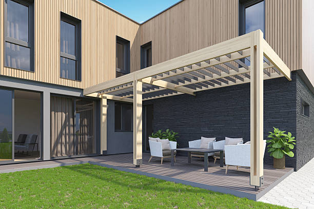 istock Modern Backyard Terrace with Canopy, Wood Decking, and Scandinavian Facade 2217568511