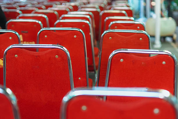 seen from behind the row of red chairs