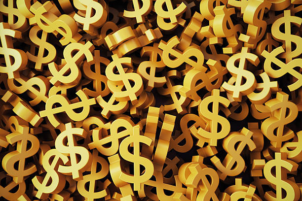 istock Golden Dollar Symbols Stacks on Background 2217572614