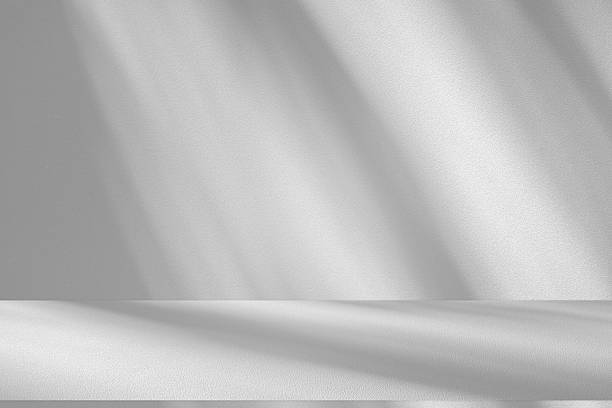 istock Wall interior background, studio and backdrops show products.with shadow from window color white . background for text insertion and presentation product 2217577313