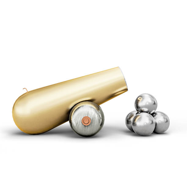 A shiny miniature golden cannon accompanied by silver cannonballs displayed on a white surface, exuding a sense of collectability and uniqueness. 3D Illustration. File with Clipping Path.