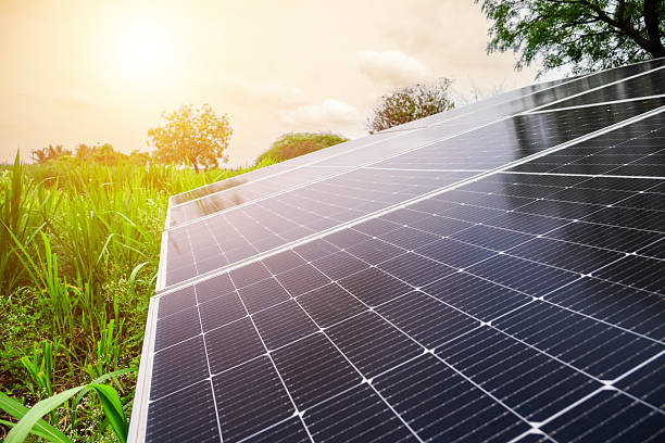 istock solar panels at a solar farm at bright sunset. Solar cell power plants. water system pumped with Solar panels. smart agriculture 2217578407