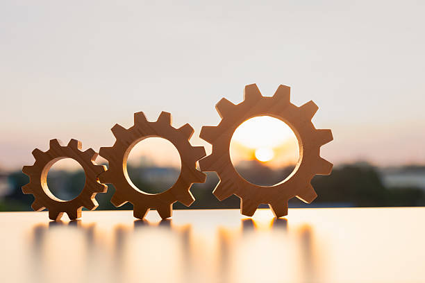 istock Gears from at urban and sunlight background. concept of a teamwork cooperation idea. 2217583078