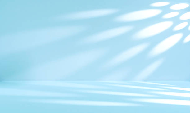 istock Blue shadow light overlay on white cement wall room and floor well display product advertising 2217583098