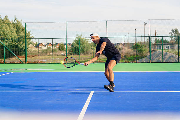 istock Tennis player performing a backhand stroke during a match 2217584332