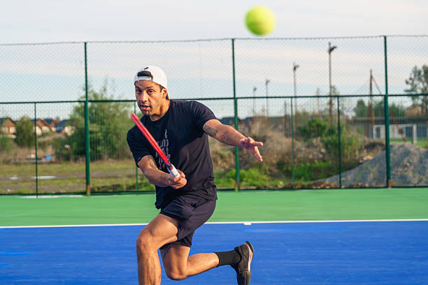 istock Tennis player hitting forehand on a sunny day 2217584347