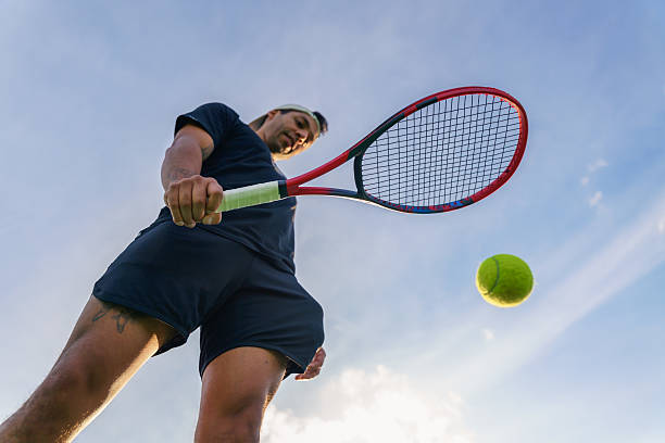 Tennis player preparing to hit ball with racket