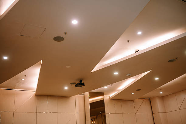 istock Modern architectural ceiling design with recessed lighting and projector installation 2217584462