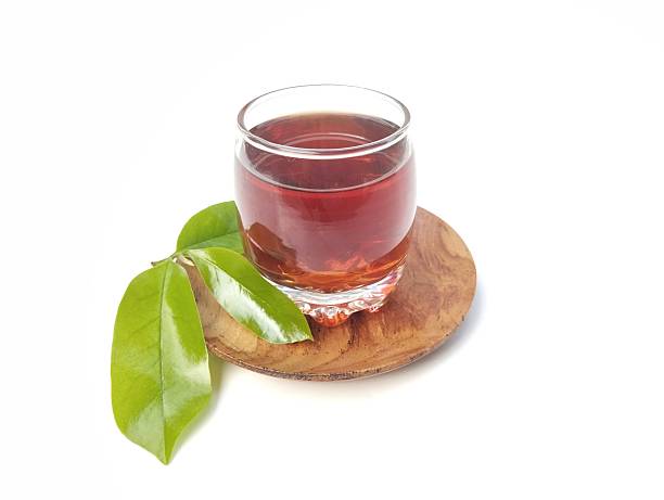 istock Soursop leaf boiled water in glass on white background 2217591145