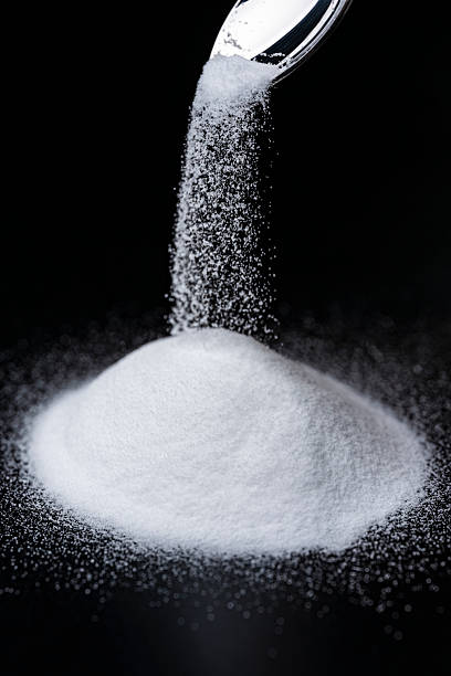 istock Baking Soda Powder Falling Against Black Background 2217593718