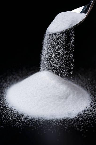 istock Baking Soda Powder Falling Against Black Background 2217593727