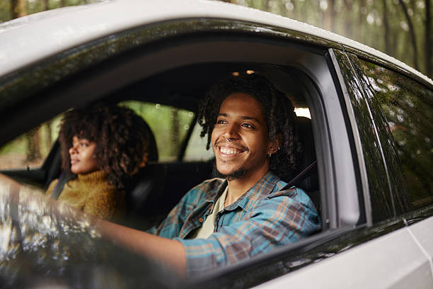 istock Happy black couple going on a trip by car. 2217595313