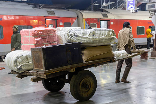 Luggage Transfer Trolley with Heavy Loads at Railway Platform in the Evening image is taken at jodhpur railway station rajasthan india on Oct 27 2023.