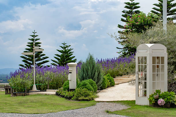 A park decorated with flowers and other things for tourists to take pictures.
