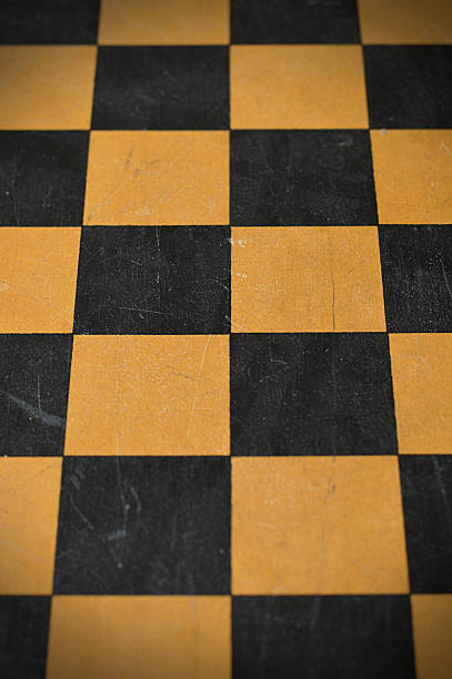 istock Vertical high angle view click of blank empty textured wooden tiled chess board with old scratched scuffed weathered run down surface 2217598307