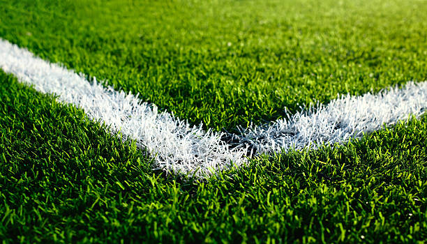 istock artificial green turf with white painted sports field boundary lines 2217601902